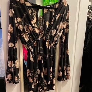 Floral design romper,long sleeve, small, worn once. In perfect shape.